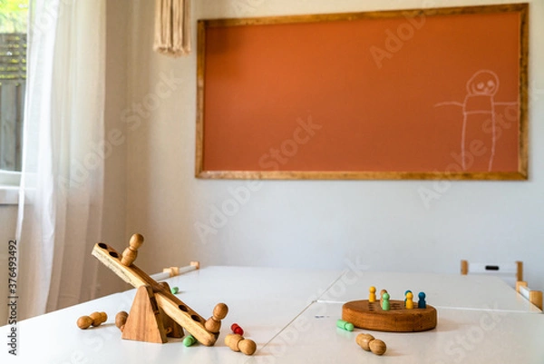 Fototapeta Play area in a childcare centre with board game pieces