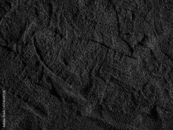 Fototapeta A close up of a black coal texture, dark coal background