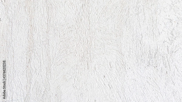 Fototapeta White cement wall background in vintage style for graphic design or wallpaper. Pattern of soft concrete floor in retro concept.