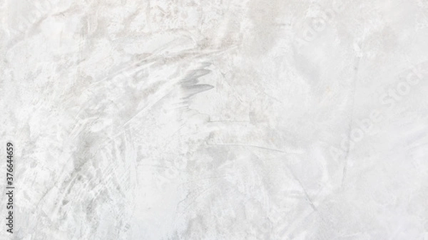 Fototapeta White cement wall background in vintage style for graphic design or wallpaper. Pattern of soft concrete floor in retro concept.