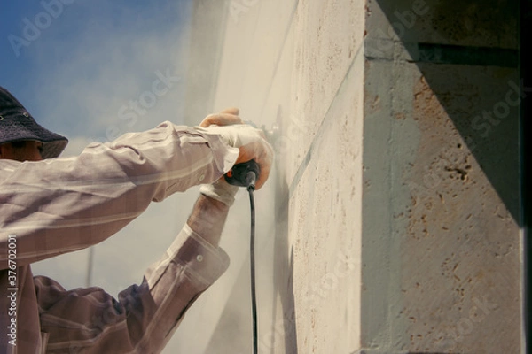 Fototapeta young master polishes ghost stone