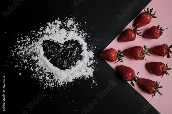 Fototapeta Kitchen table with products, top view. Strawberry and flour. Top view in frame only ingredients.