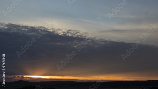 Obraz Sky 16: 9, sunset with rays under the clouds