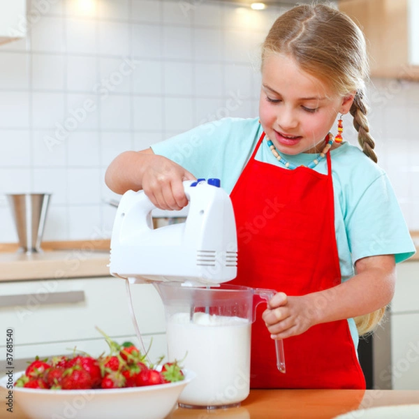 Obraz little girl with mixer in kitchen