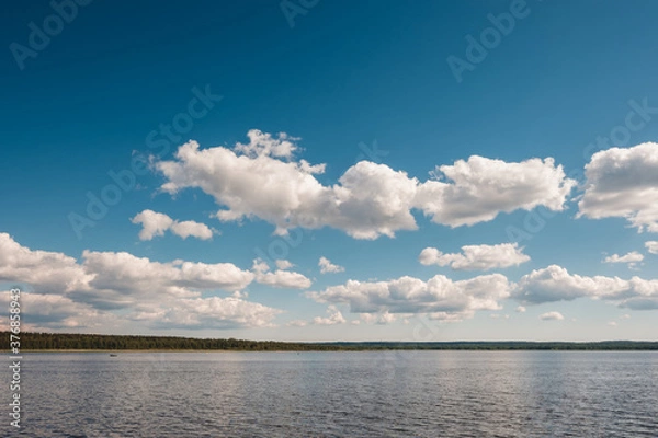 Obraz Vuoksa river near Imatra in the Leningrad region, Russia. Coastline with pine forest reflected in Vuoksa water, near Finland. River bank