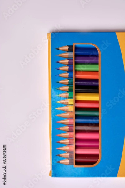 Obraz colored pencils packaged on a white background