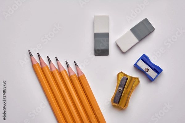 Obraz pencils, pencil sharpener, eraser on a white background