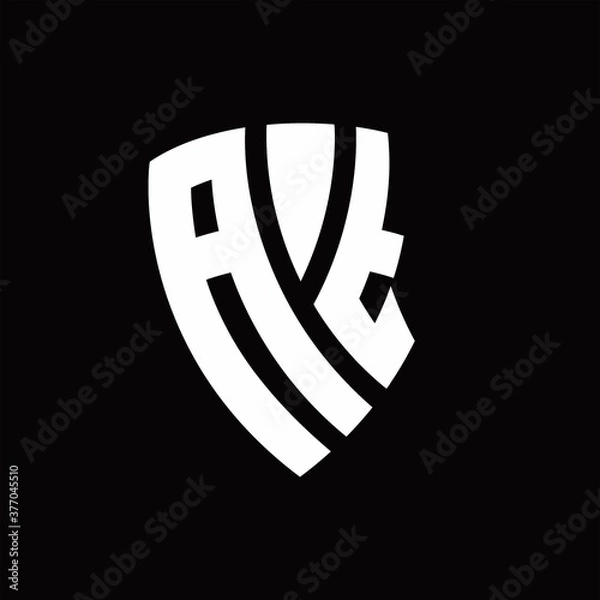 Fototapeta AT Logo monogram with shield elements shape design template