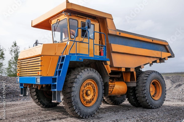 Fototapeta The mountainous dump truck is widely used for transporting and unloading rocks. Mining.
