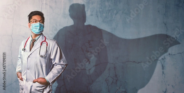 Fototapeta Brave Doctors with his shadow of superhero on the wall. Concept of powerful man