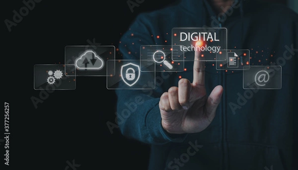 Fototapeta Business and technoloy concept.Business man touch digital tecchnology screen interface and a businessman in background.
