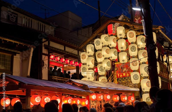 Fototapeta Night view of Yamahoko float with lanterns and people listening to music in Gion Festival in Kyoto, Japan
