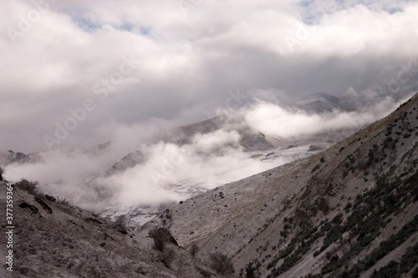 Fototapeta clouds in the mountains