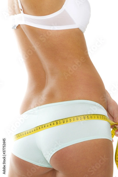 Fototapeta Frau misst Umfang vom Po