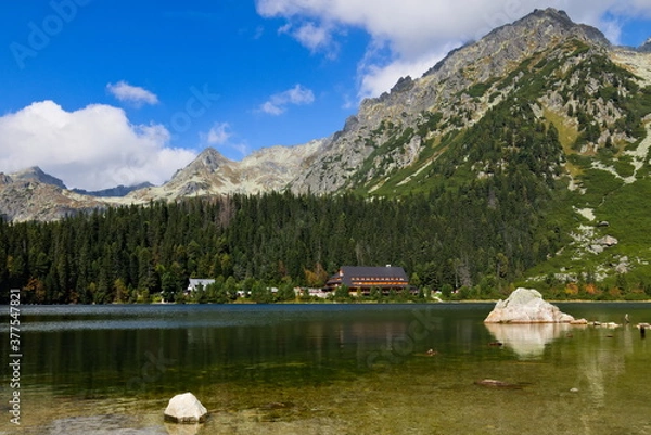 Fototapeta Mountain lake with solitary rocks in the foreground 