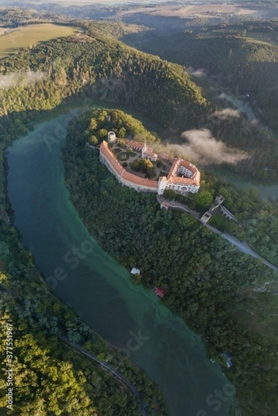 Fototapeta Bitov Medieval castle in South Moravia region during amazing sunrise, Czech republic, Europe. Aerial drone view. Summer or autumn time. Misty and sunny atmosphere.