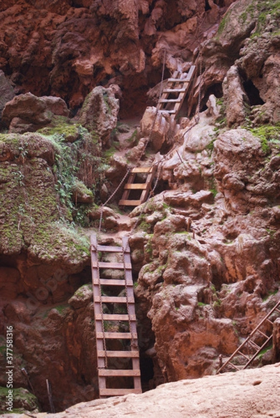 Obraz Makeshift ladder up a steep cliff