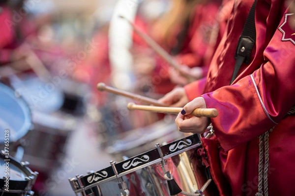 Fototapeta close-up of hands playing the drum during easter