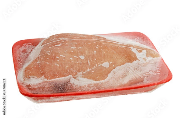 Fototapeta Frozen raw turkey breast on foam meat tray