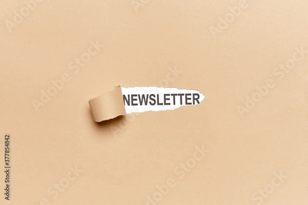 Fototapeta Broken brown wrapping paper with the word NEWSLETTER appearing