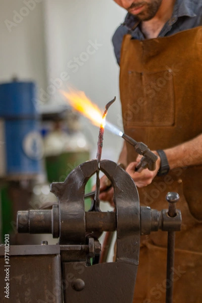 Obraz A blacksmith work on metal