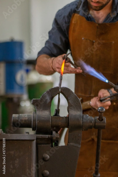 Obraz A blacksmith work on metal