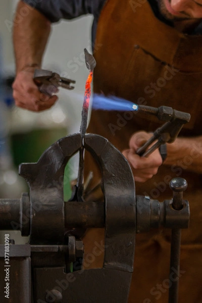 Obraz A blacksmith work on metal