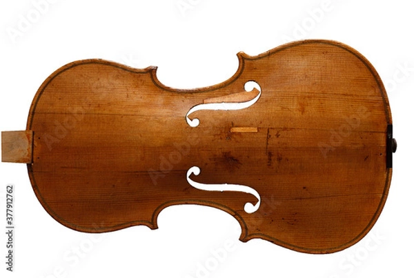 Fototapeta Antique violin top plate with cracks and some damage repaired isolated on white background
