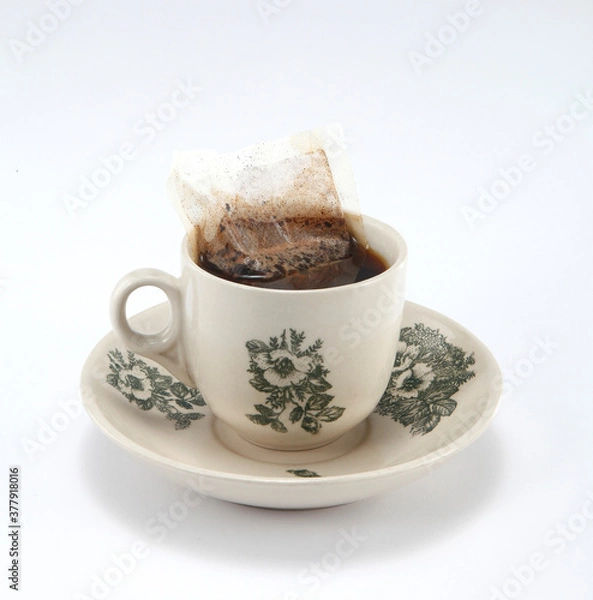 Fototapeta Kopi is a type of traditional coffee local to Singapore and Malaysia. It is a highly caffeinated black coffee served with milk and sugar.