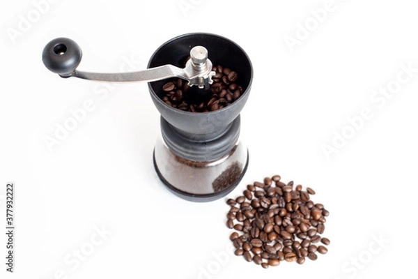 Obraz coffee grinder with coffee beans on white background