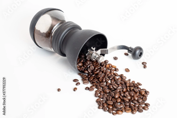Obraz coffee grinder with coffee beans on white background