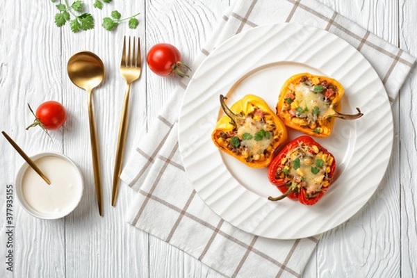Fototapeta stuffed bell peppers with ground beef, corn