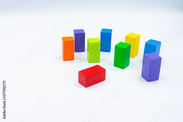 Obraz Untidy variety colorful blocks see sleep red block at white background