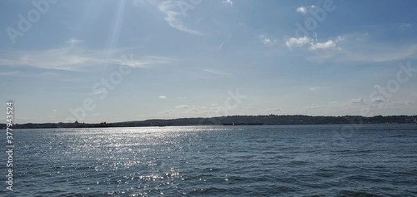 Fototapeta clouds over the sea