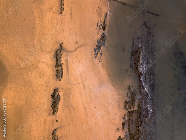 Obraz Beach rocks from above at low tide