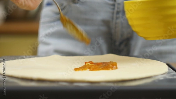Obraz Cooking pizza. The chef prepares the pizza dough. A man or woman is engaged in home business preparing a delicious pizza