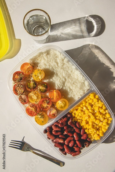 Obraz Homemade vegetarian food in lunch boxes with healthy vegetables. Vegetarian food concept. Healthy food. Top view, flat lay.