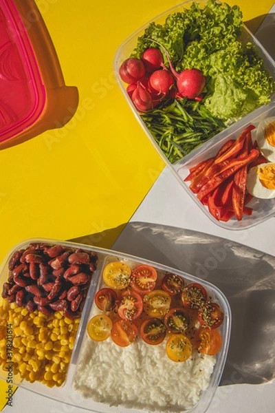 Obraz Homemade vegetarian food in lunch boxes with healthy vegetables. Vegetarian food concept. Healthy food. Top view, flat lay.