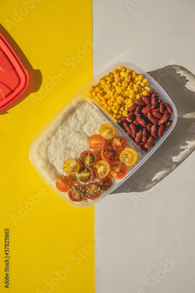 Obraz Homemade vegetarian food in lunch boxes with healthy vegetables. Vegetarian food concept. Healthy food. Top view, flat lay.
