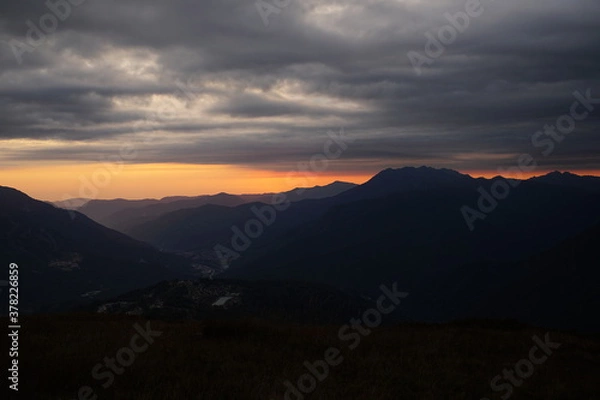 Fototapeta sunset over the mountains