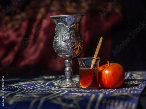 Fototapeta Rosh Hashana still life with apple, honey and kiddush cup using shallow depth of field and selective focus