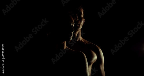 Obraz Couple on a dark background. Sensual. Couple love. Shadow. 