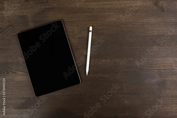 Obraz Tablet and electronic pen on the table.