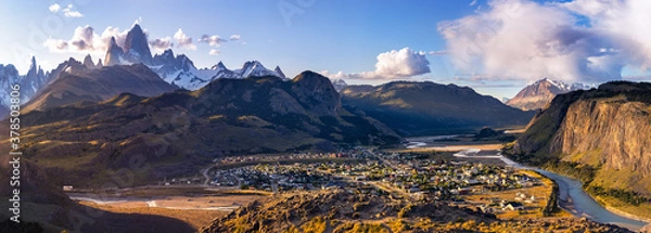 Fototapeta Panoramic view at dawn on the village of el chalten and the Patagonian mountains of Cerro Torre and Fitz Roy. Border between Chile and Argentina