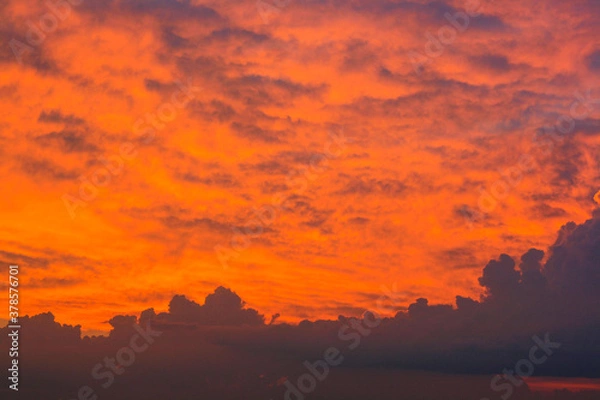 Fototapeta red and orange sun set on the open sky