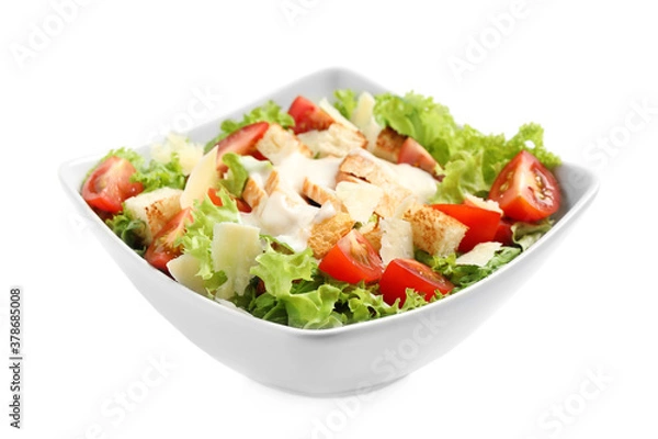 Obraz Delicious fresh Caesar salad in bowl on white background