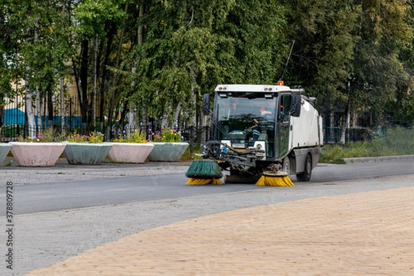 Fototapeta Machine for cleaning city streets and sidewalks.