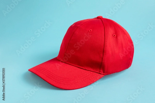 Obraz Red Baseball Cap on blue background