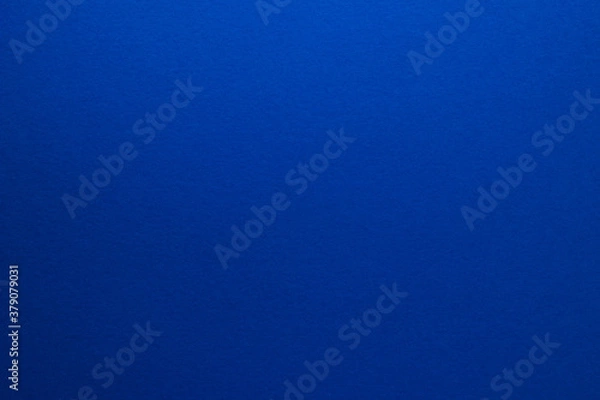 Fototapeta Blue background. Sheet of blank blue paper with texture, close up.