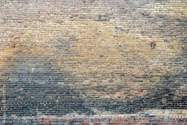 Fototapeta Weathered stained old brick wall background on surface